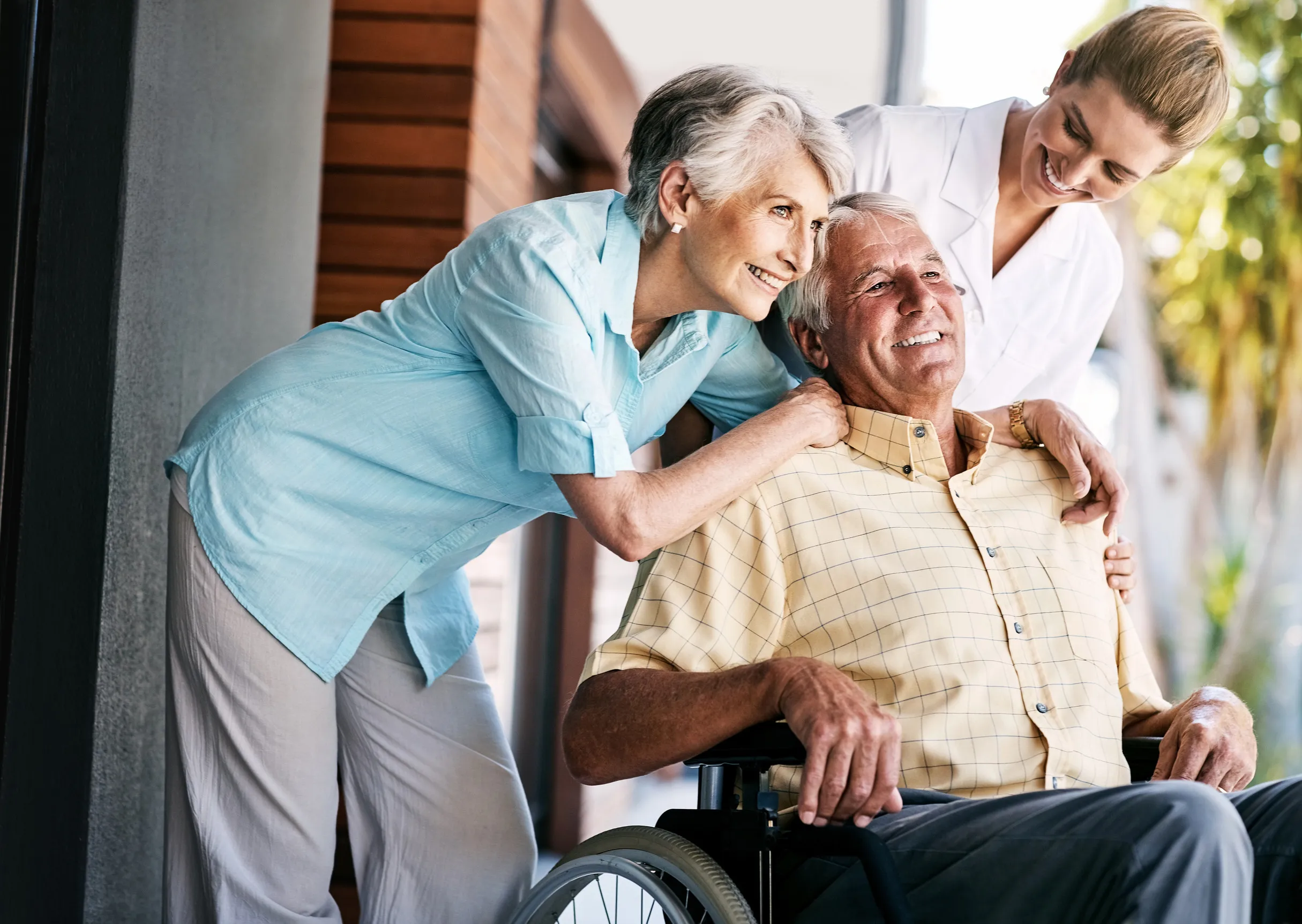 202074374_m Were all here for you my dear. a senior couple and a nurse outside a retirement home